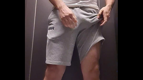 Straight guy pissing from side of shorts